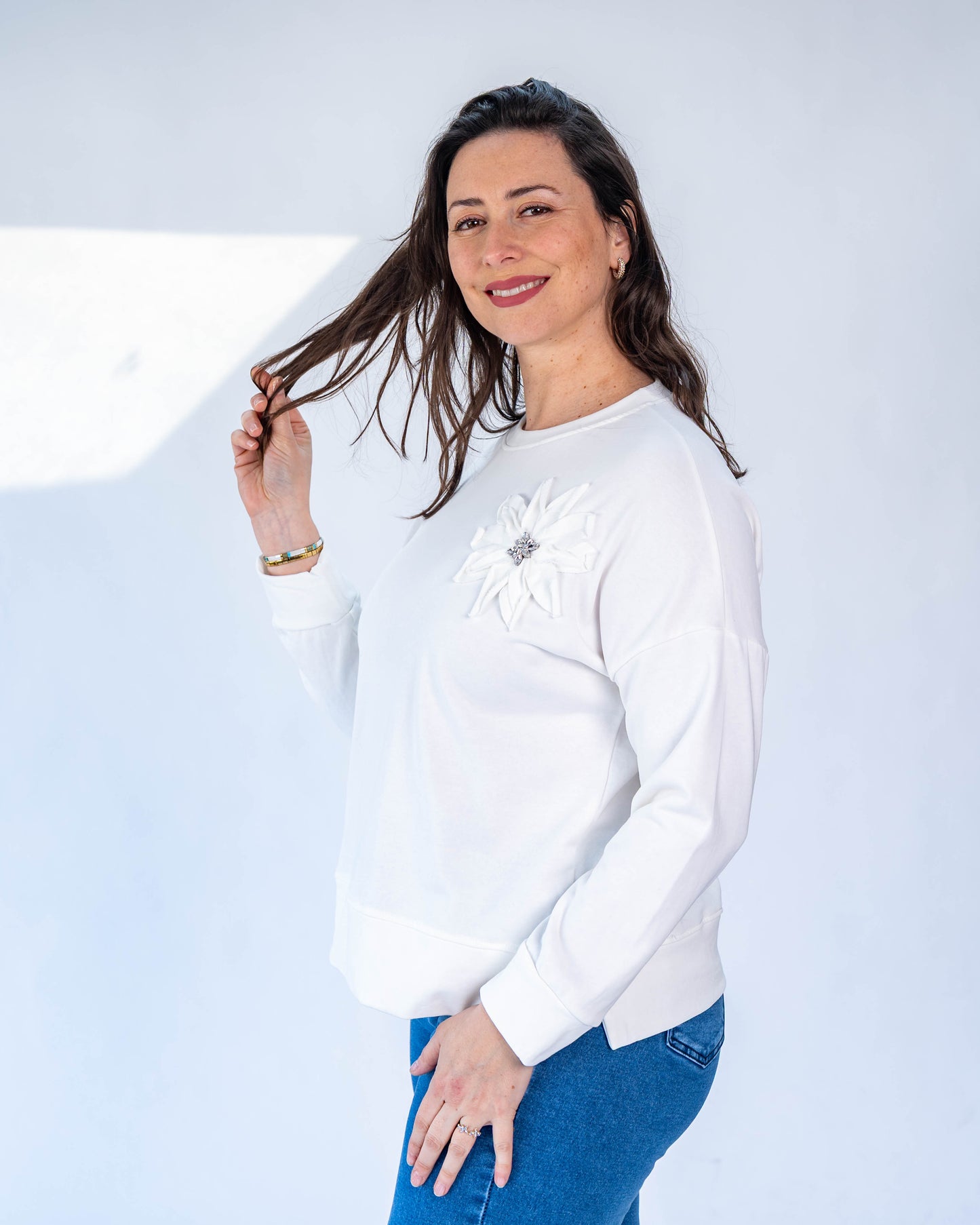 Polerón flor blanco